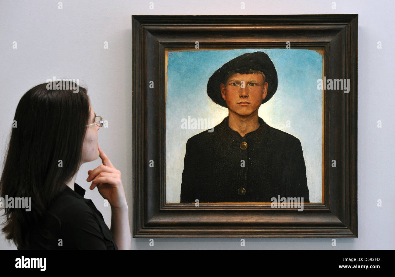 A woman looks at a self portrait by Otto Dix (1912) at Museum Gunzenhauser in Chemnitz, Germany, 07 June 2010. The birth town of the painter, Gera, and the city of Chemnitz, jointly prepare exhibitions and other events to celebrate the painter's 120th birthday. Chemnitz will host the special exhibition 'Otto Dix in Chemnitz' and Gera will present an exhibition titled 'Otto Dix - re Stock Photo