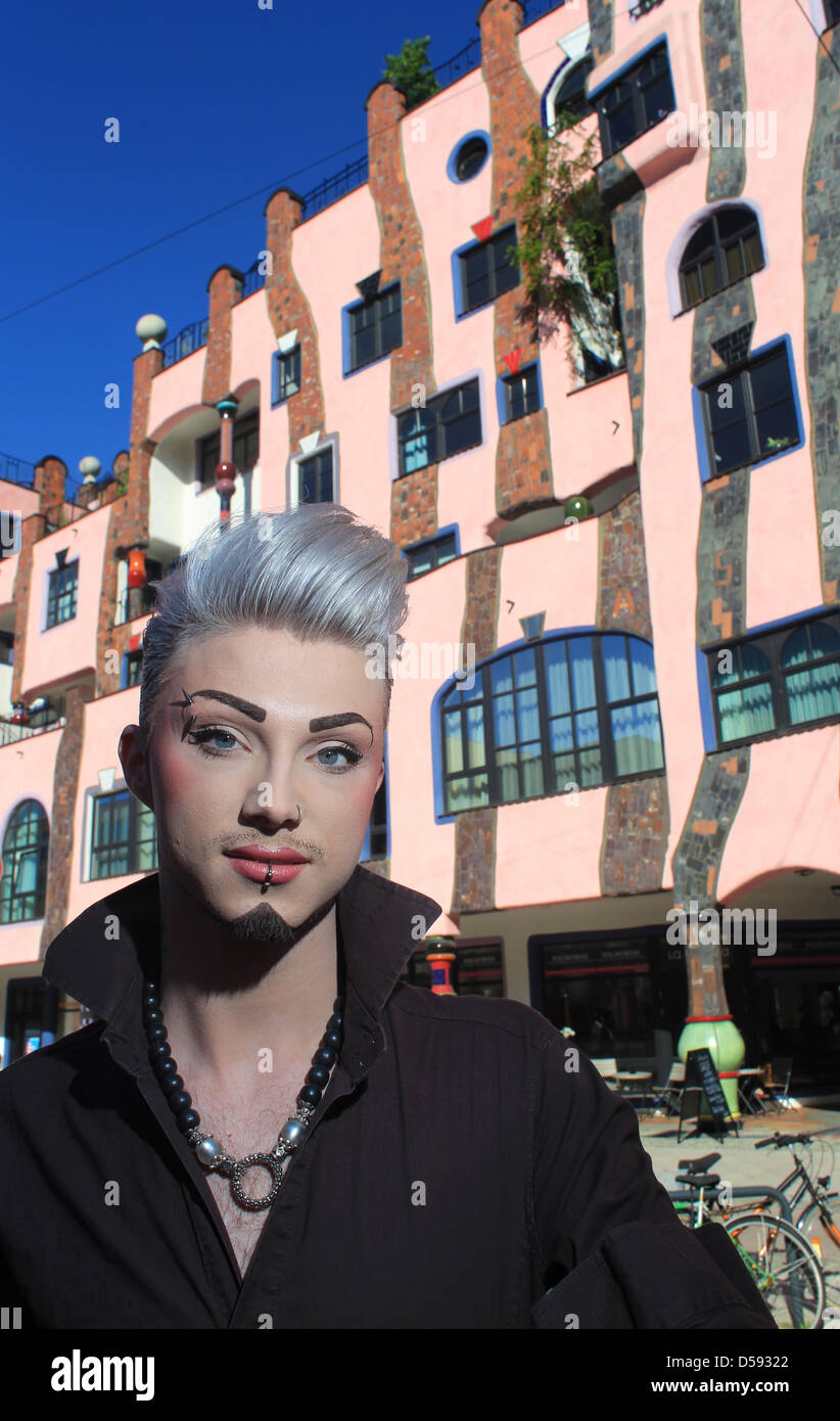 Hairdresser Sebastian Boehm poses in front of his hair salon 'Rocksthaar' in the Hundertwasser building in Magdeburg, Germany, 03 June 2010. The flamboyant personality is responsible for the hairdo of 'Tokio Hotel' singer Bill Kaulitz and opened his second salon in Magdeburg in May 2010. Photo: Jens Wolf Stock Photo