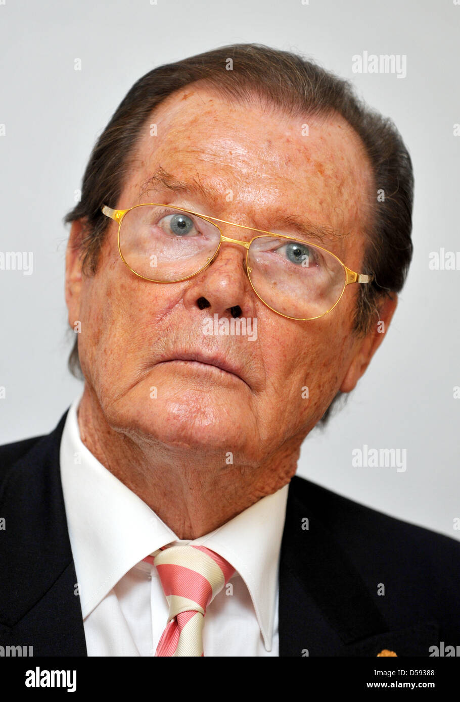 British actor Sir Roger Moore delivers a press conference in Buehl