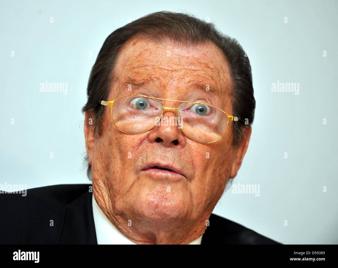 British actor Sir Roger Moore delivers a press conference in Buehl