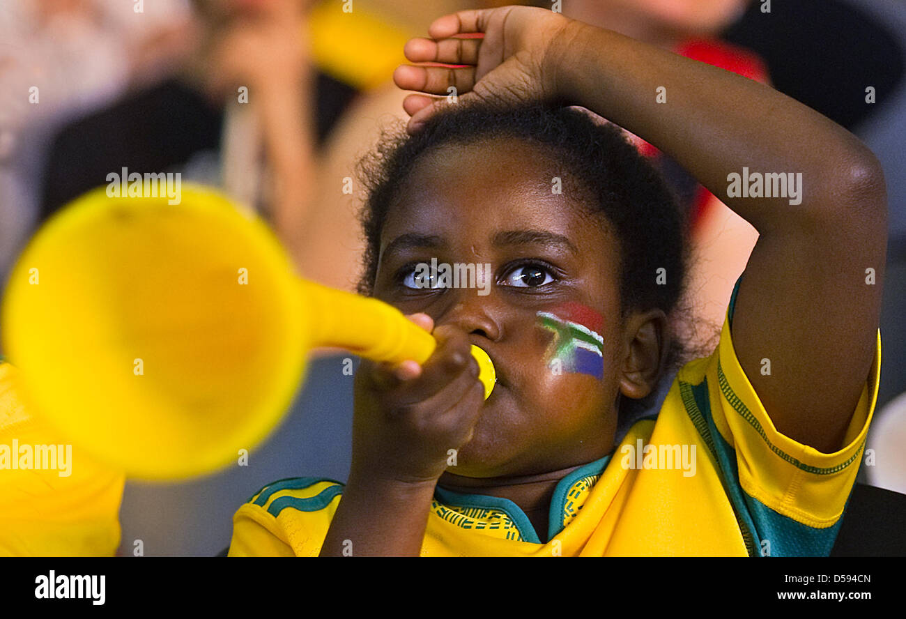 South African soccer fans follow the openeing ceremony of the FIFA World Cup 2010 during a