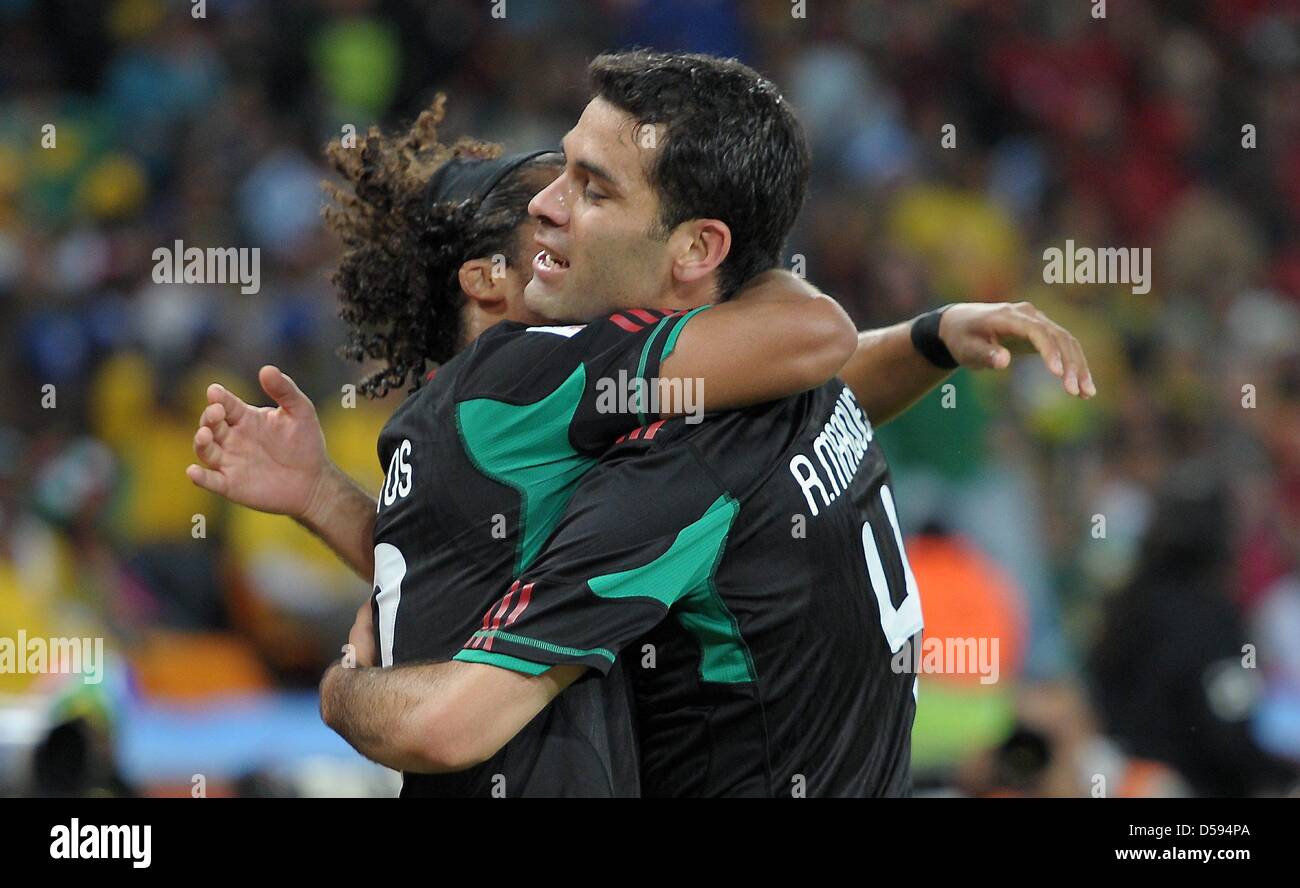 Rafael Marquez (R) celebrates with Andres Guardado (L) after scoring the 1-1 equalizer of Mexico during the 2010 FIFA World Cup opening match at Soccer City stadium in Johannesburg, South Africa 11 June 2010. Photo: Please refer to http://dpaq.de/FIFA-WM2010-TC  +++(c) dpa - Bildfunk+++ Stock Photo
