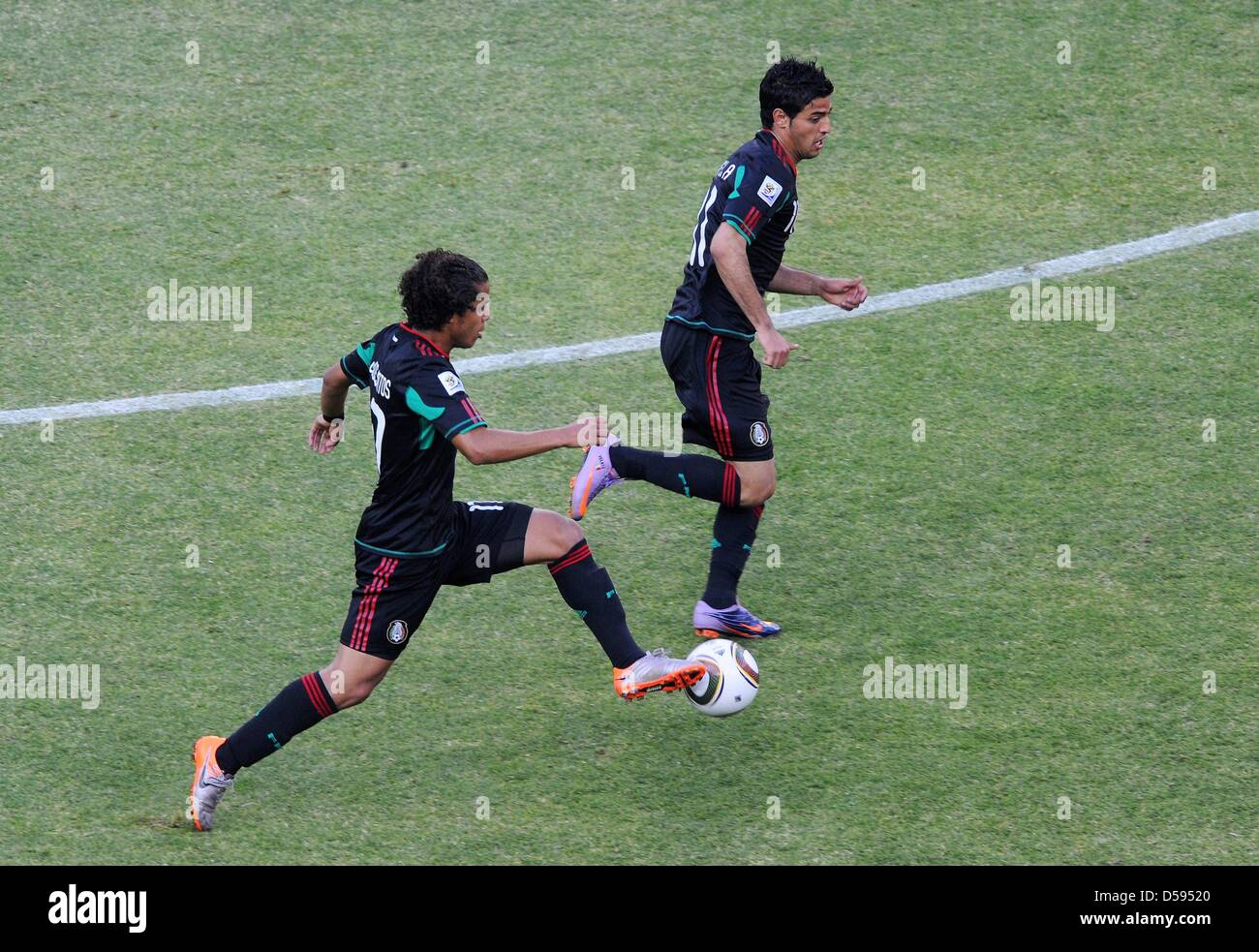 Giovani dos Santos (L) and Carlos Vela of Mexico in action during the 2010 FIFA World Cup opening match against South Africa at Soccer City stadium in Johannesburg, South Africa 11 June 2010. Photo: Marcus Brandt dpa Please refer to http://dpaq.de/FIFA-WM2010-TC Stock Photo