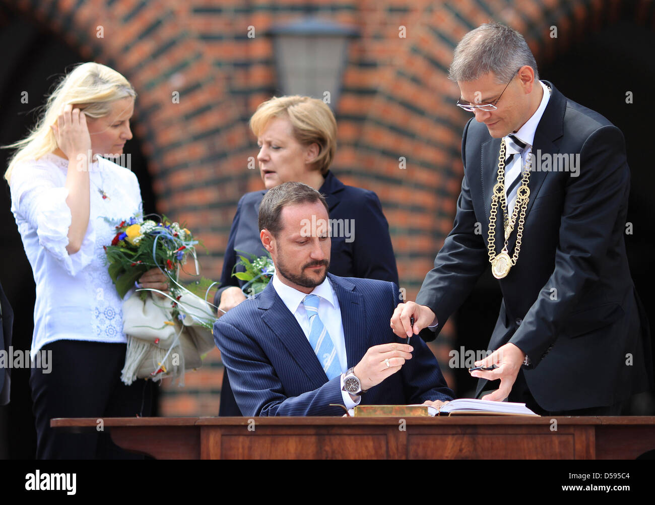 norway-s-crown-prince-haakon-c-signs-the-guestbook-of-the-city-in-the