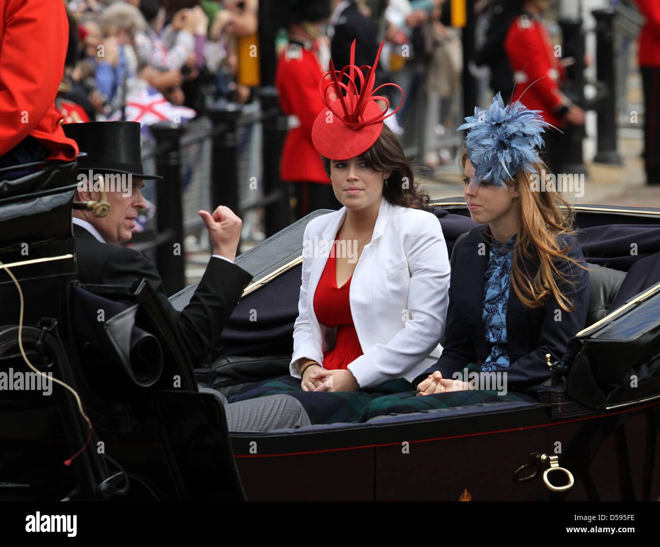 Britain's Princess Eugenie (C) and Princess Beatrice leave Buckingham Palace to attend the Trooping the Colour ceremony, in London, Britain, 12 June 2010. Trooping the Colour is a ceremony to honour the sovereign's official birthday, even though Britain's Queen Elizabeth, 82, was born on 21 April 1926. 1,100 soldiers from the Household Division take part in the ceremony. The parade Stock Photo