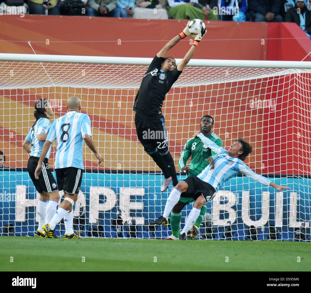 Goalkeeper Sergio Romero (C) of Argentina saves the ball during the FIFA World Cup group B soccer match between Argentina and Nigeria at Ellis Park Stadium in Johannesburg, South Africa, 12 June 2010. Photo: Ronald Wittek dpa Please refer to http://dpaq.de/FIFA-WM2010-TC Stock Photo