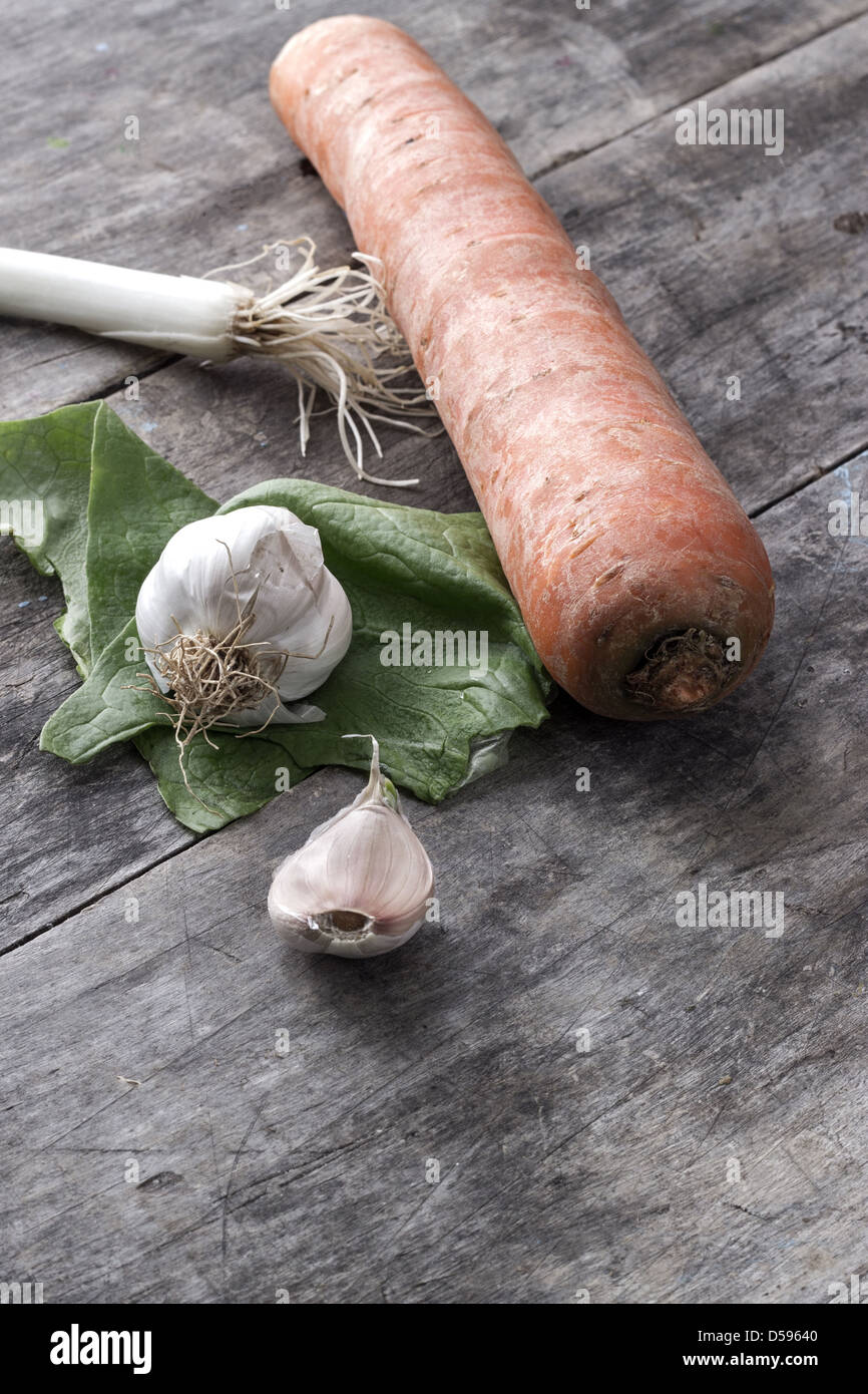 garlic, onions and carrot on table,close up Stock Photo