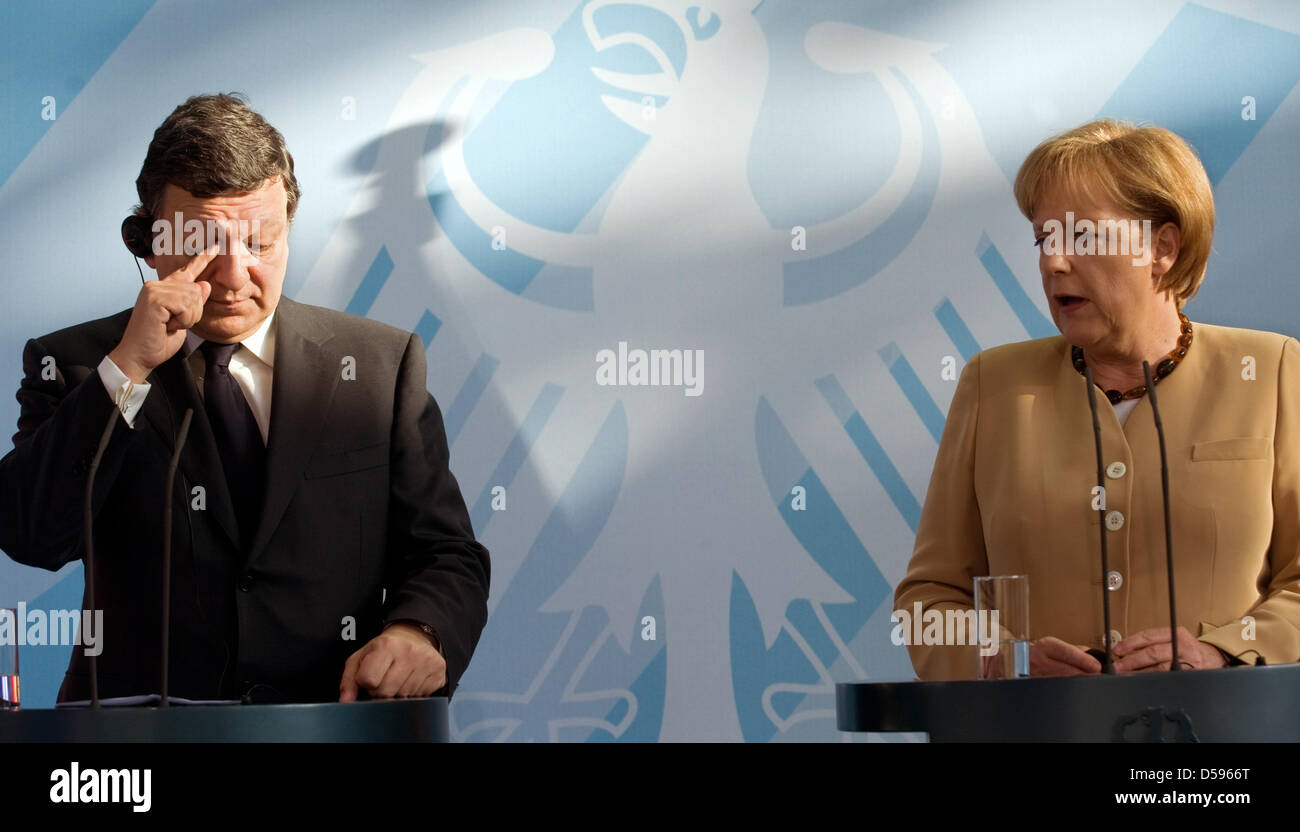 President of the European Commission, Jose Manuel Barroso and Germany's chancellor Angela Merkel hold a press conference together at Federal Chancellery in Berlin, Germany, 11 June 2010. Both politicians came together for discussions. The meeting served as a preparation for the EU summit in Brussels on 17 June 2010. The EU's chiefs of state and heads of government want to talk abou Stock Photo