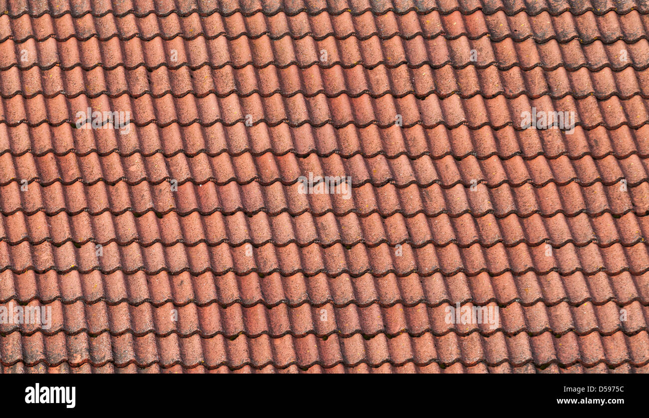 Old red slate tiles roof background texture Stock Photo