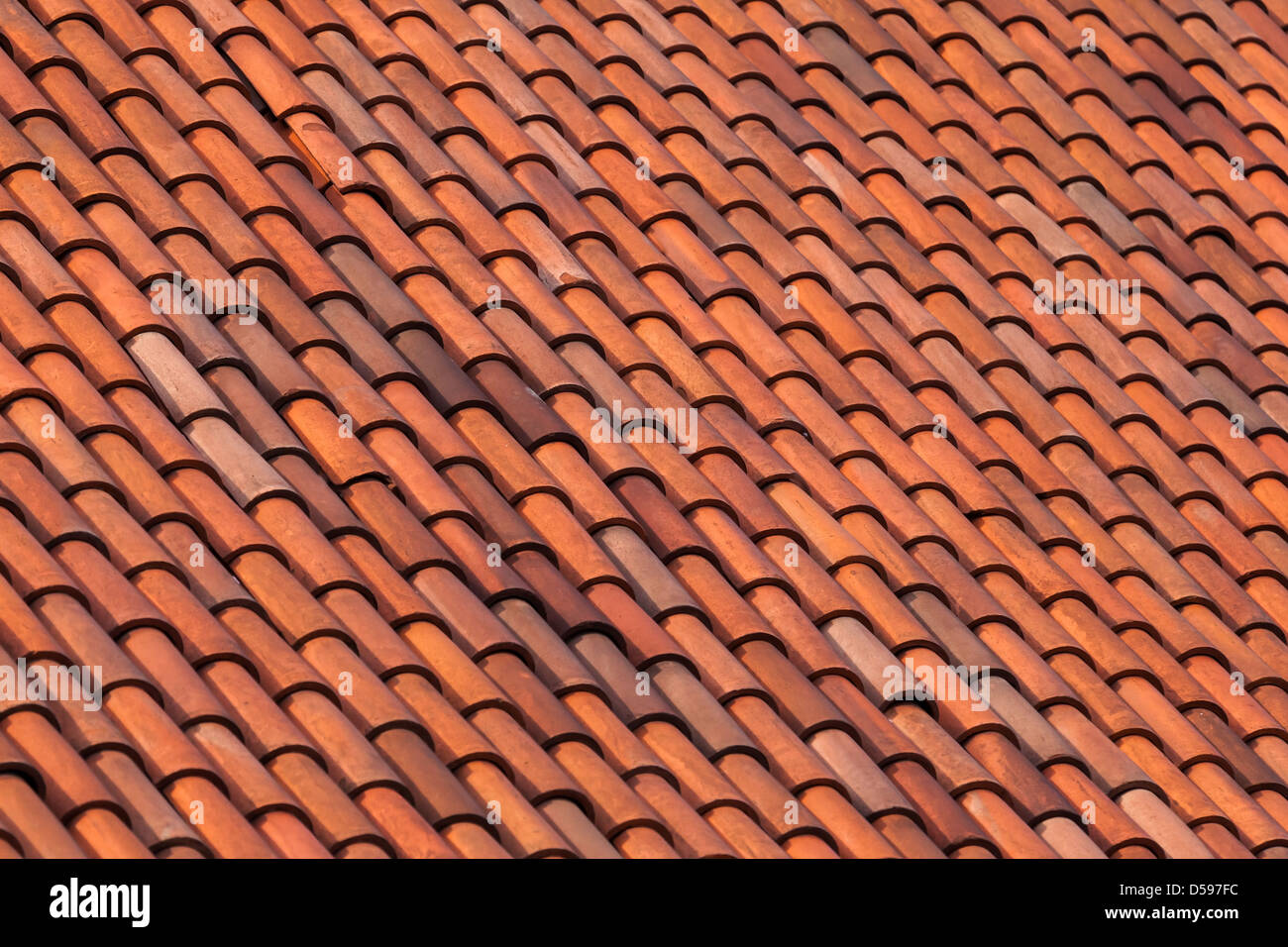 Old red slate tiles roof abstract background texture Stock Photo
