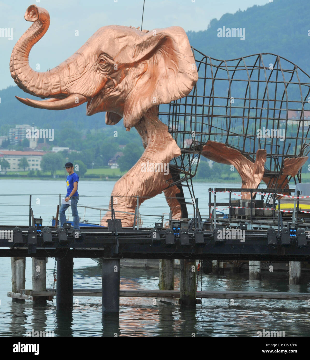 A huge elephant, part of the stage setting for the opera Aida, arrives at the lake theatre 'Seebuehne' in Bregenz, Austria, 14 June 2010. The sculpture is more than 8m tall and 14 metres long and was ferried across Lake Constance from Fussach, which is situated 10km from Bregenz.  Aida will premiere at the world's largest lake stage on 22 July 2010. Photo: STEFAN PUCHNER Stock Photo