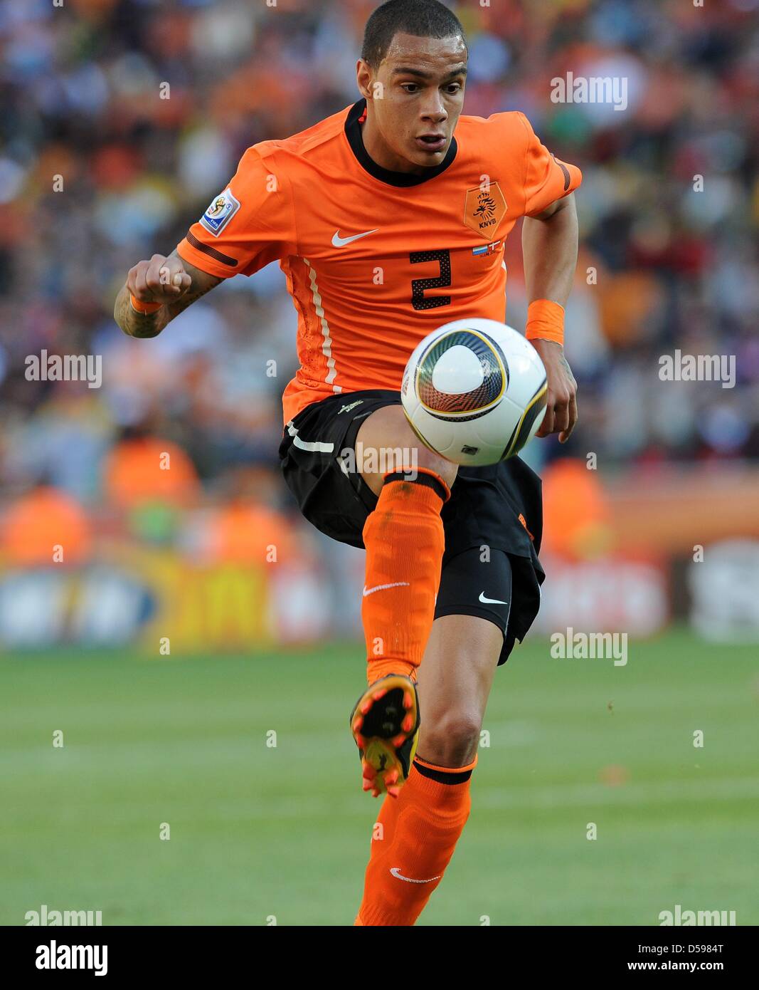 Gregory van der Wiel of the Netherlands controls the ball during the 2010  FIFA World Cup final match between the Netherlands and Spain at the Soccer  City Stadium in Johannesburg, South Africa