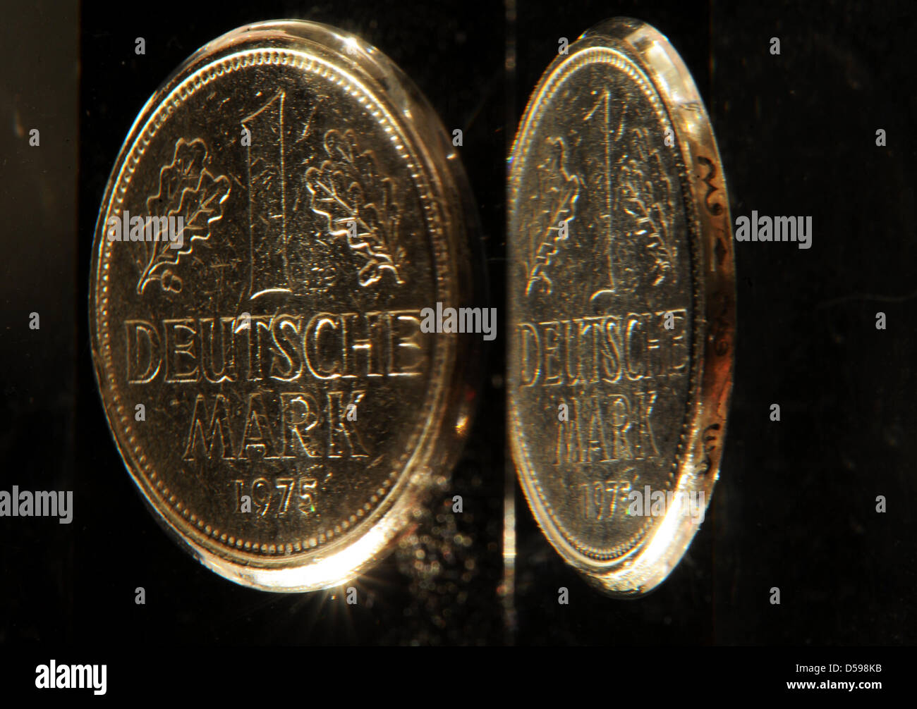A D-Mark coin bordered in acryl and its reflection pictured in Berlin ...