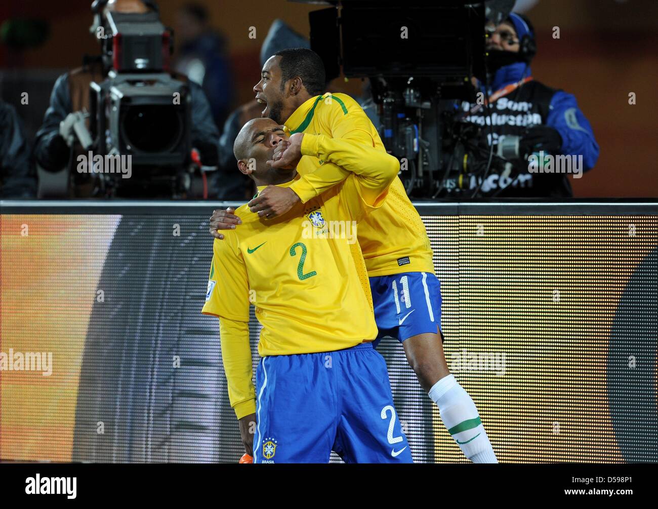 Brazil's Maicon (L) celebrates scoring the 1-0 with team-mate Robinho during the 2010 FIFA World Cup group G match between Brazil and North Korea at Ellis Park stadium in Johannesburg, South Africa 15 June 2010. Photo: Achim Scheidemann - Please refer to http://dpaq.de/FIFA-WM2010-TC Stock Photo
