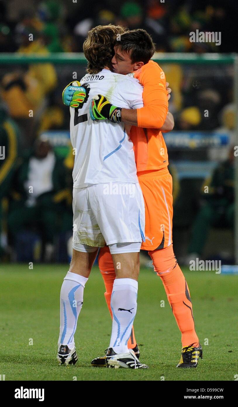 Uruguay's goalkeeper Fernando Muslera (R) celebrates with team-mate Diego Lugano during the 2010 FIFA World Cup group A match between South Africa and Uruguay at Loftus Versfeld Stadium in Pretoria, South Africa 16 June 2010. Photo: Achim Scheidemann - Please refer to http://dpaq.de/FIFA-WM2010-TC  +++(c) dpa - Bildfunk+++ Stock Photo