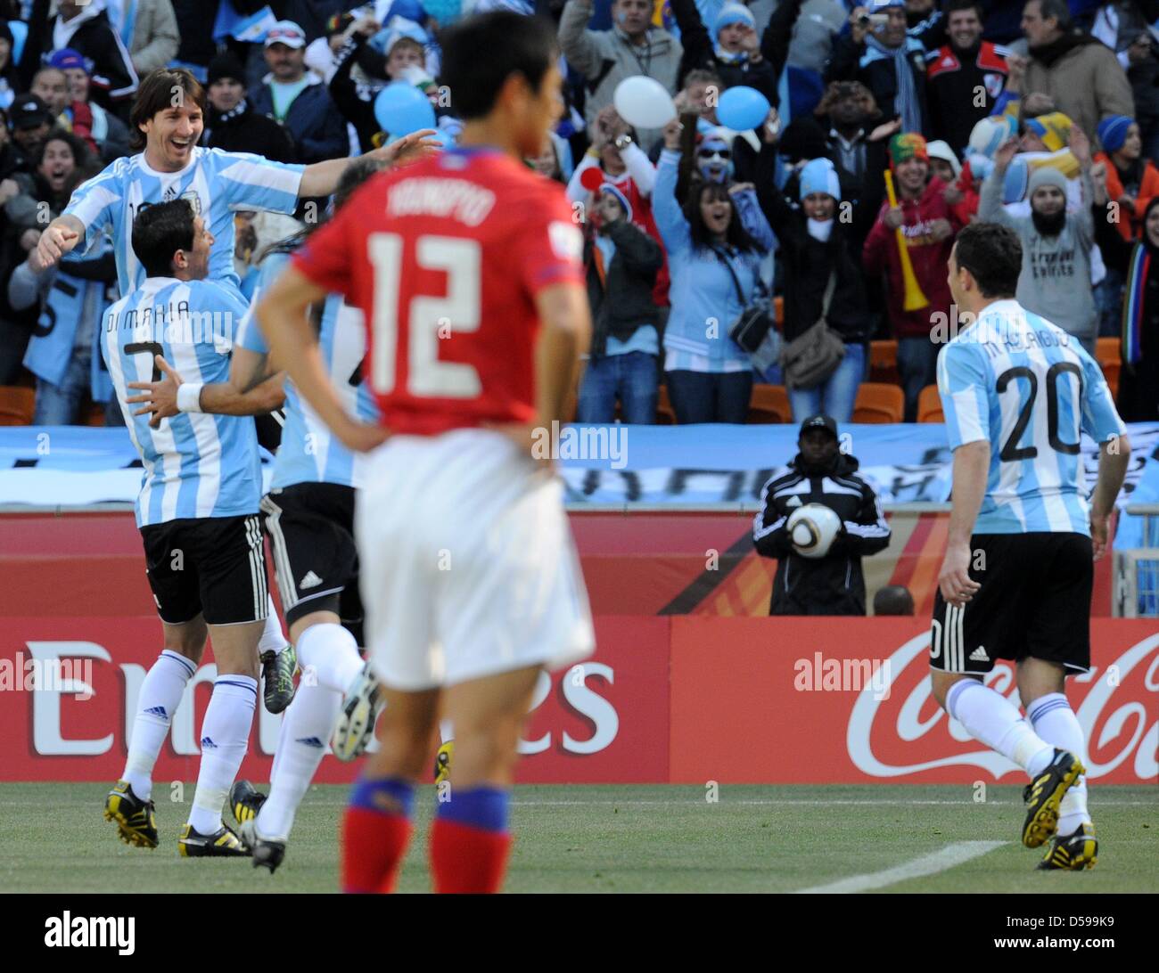 Argentina's Lionel Messi (L-R), Angel di Maria and Maxi Rodriguez celebrate the 1-0 by own goal during the 2010 FIFA World Cup group B match between Argentina and South Korea at Soccer City Stadium in Johannesburg, South Africa 17 June 2010. Photo: Achim Scheidemann - Please refer to http://dpaq.de/FIFA-WM2010-TC  +++(c) dpa - Bildfunk+++ Stock Photo