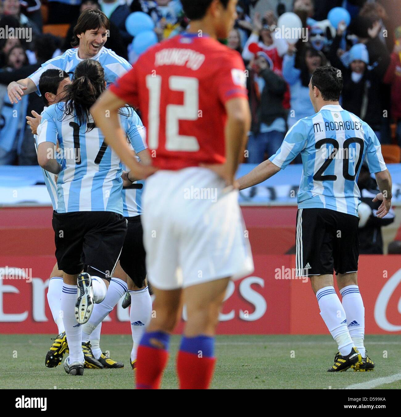 Argentina's Lionel Messi (L-R), Angel di Maria and Maxi Rodriguez celebrate the 1-0 by own goal during the 2010 FIFA World Cup group B match between Argentina and South Korea at Soccer City Stadium in Johannesburg, South Africa 17 June 2010. Photo: Achim Scheidemann - Please refer to http://dpaq.de/FIFA-WM2010-TC  +++(c) dpa - Bildfunk+++ Stock Photo
