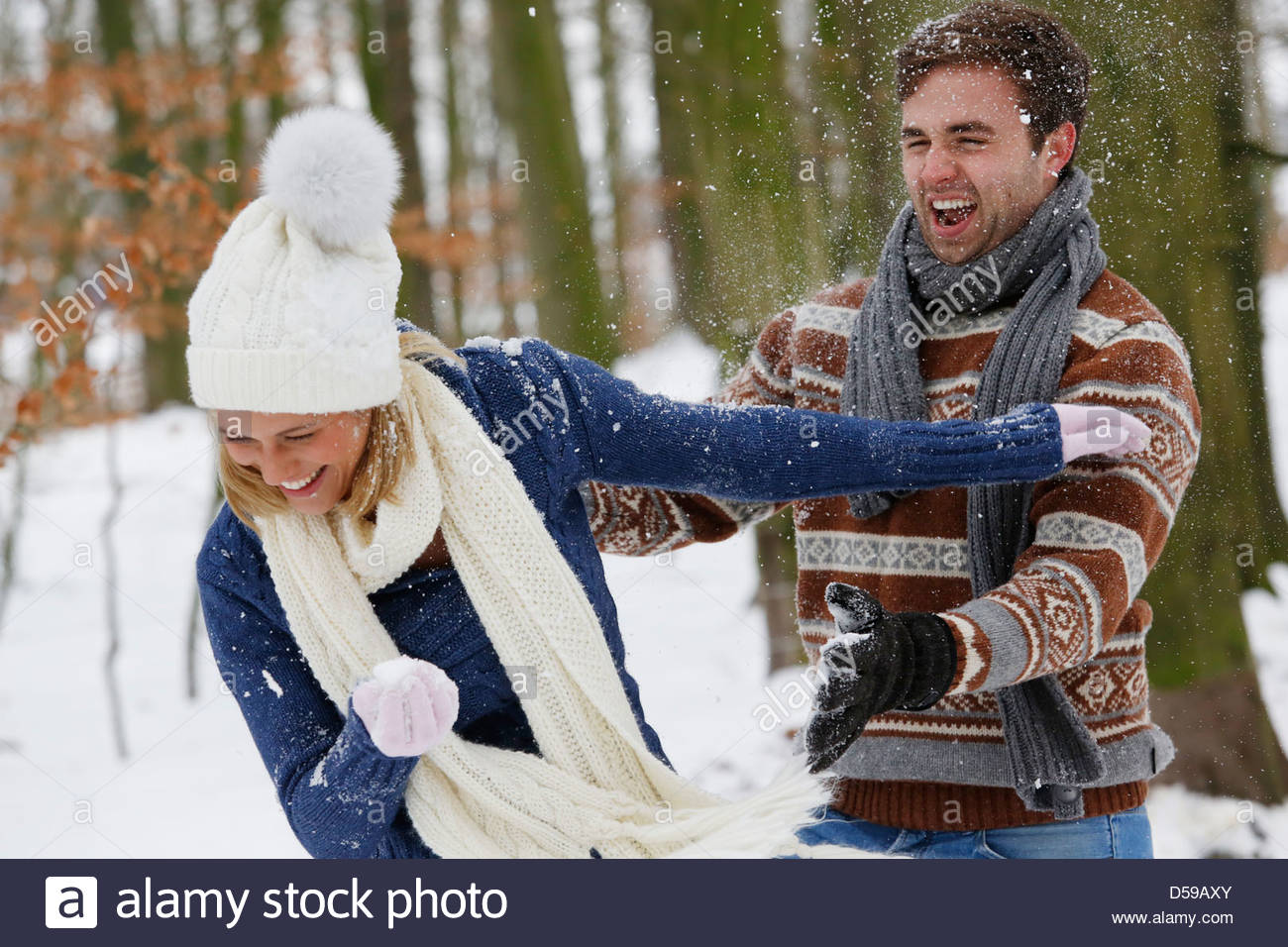 young couple take a walk in winter landscape Stock Photo