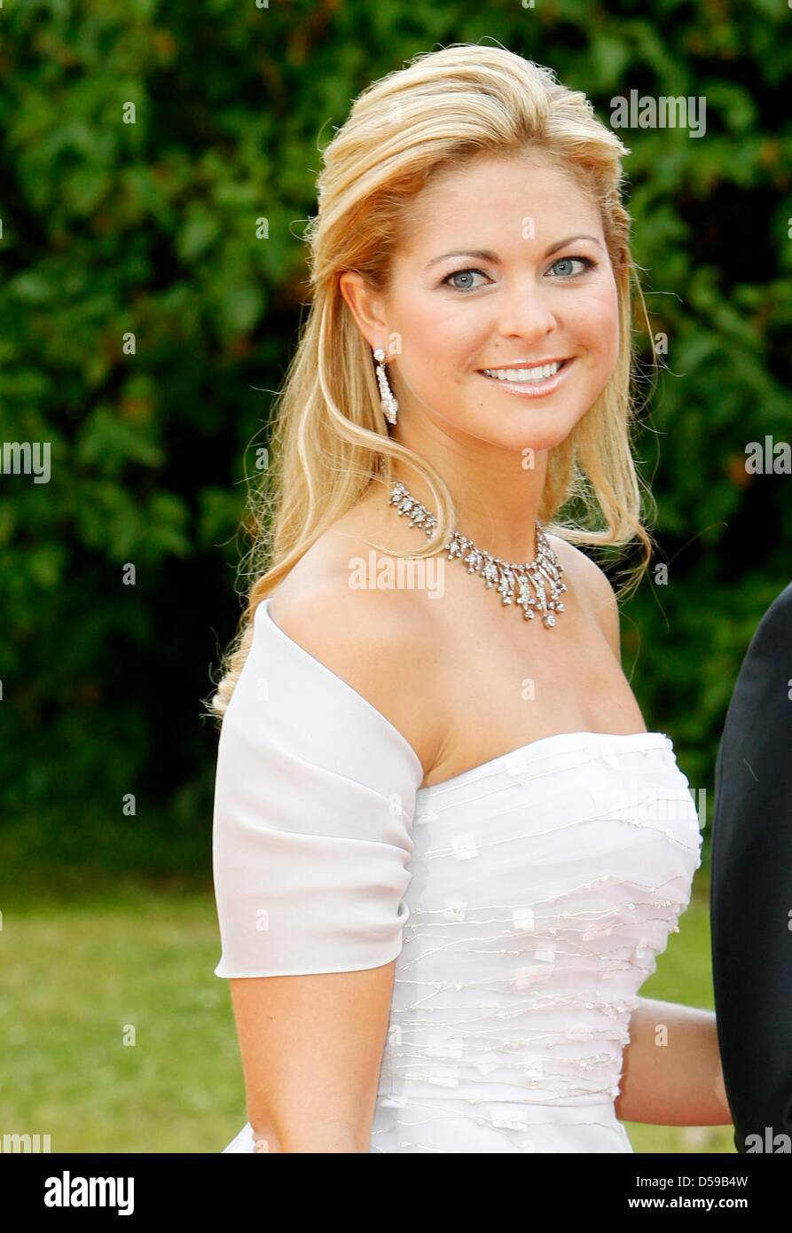 Princess Madeleine of Sweden smiles as she arrives for the government