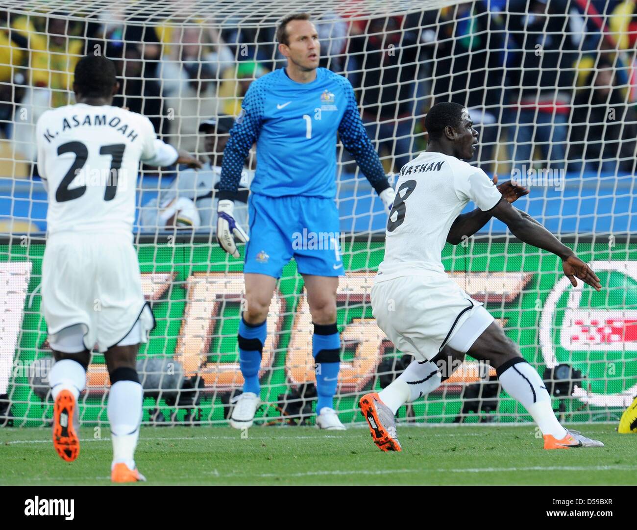 Jonathan Mensah (L) and Jonathan Mensah (R) gesture next to goalkeeper