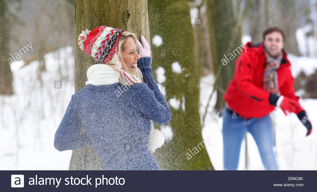 young couple take a walk in winter landscape Stock Photo