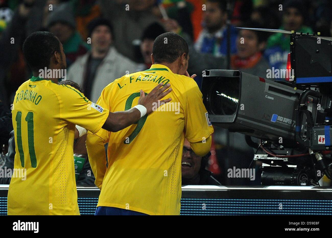 Brazil's Luis Fabiano (R) celebrates scoring the 2-0 with team mate Robinho during the 2010 FIFA World Cup group G match between Brazil and Ivory Coast at Soccer City Stadium in Johannesburg, South Africa 20 June 2010. Photo: Achim Scheidemann dpa - Please refer to http://dpaq.de/FIFA-WM2010-TC Stock Photo