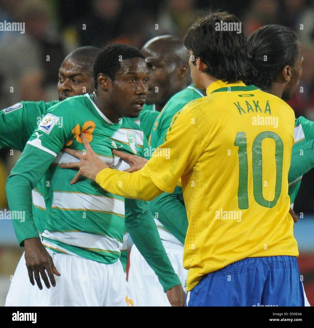 Kaka (R) of Brazil argues with Kader Keita (L) of Ivory Coast during 