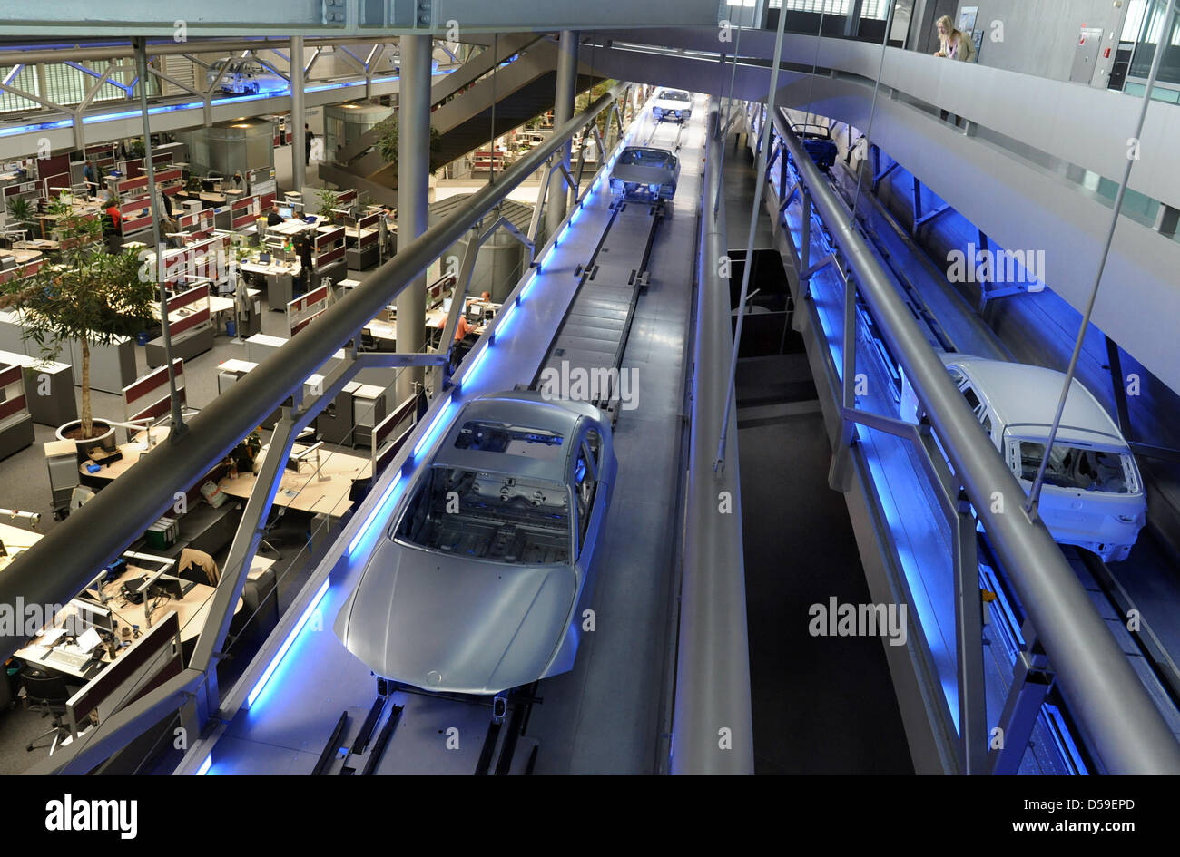 Employees of German carmaker BMW work in the assembly line at BMW's