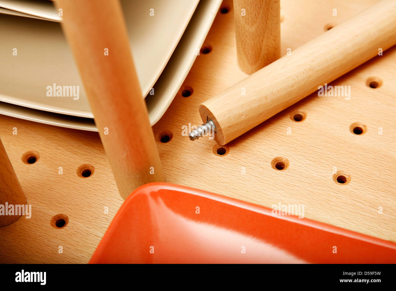 Close Up Of Divider In A Drawer For Dishes Containing Colourful
