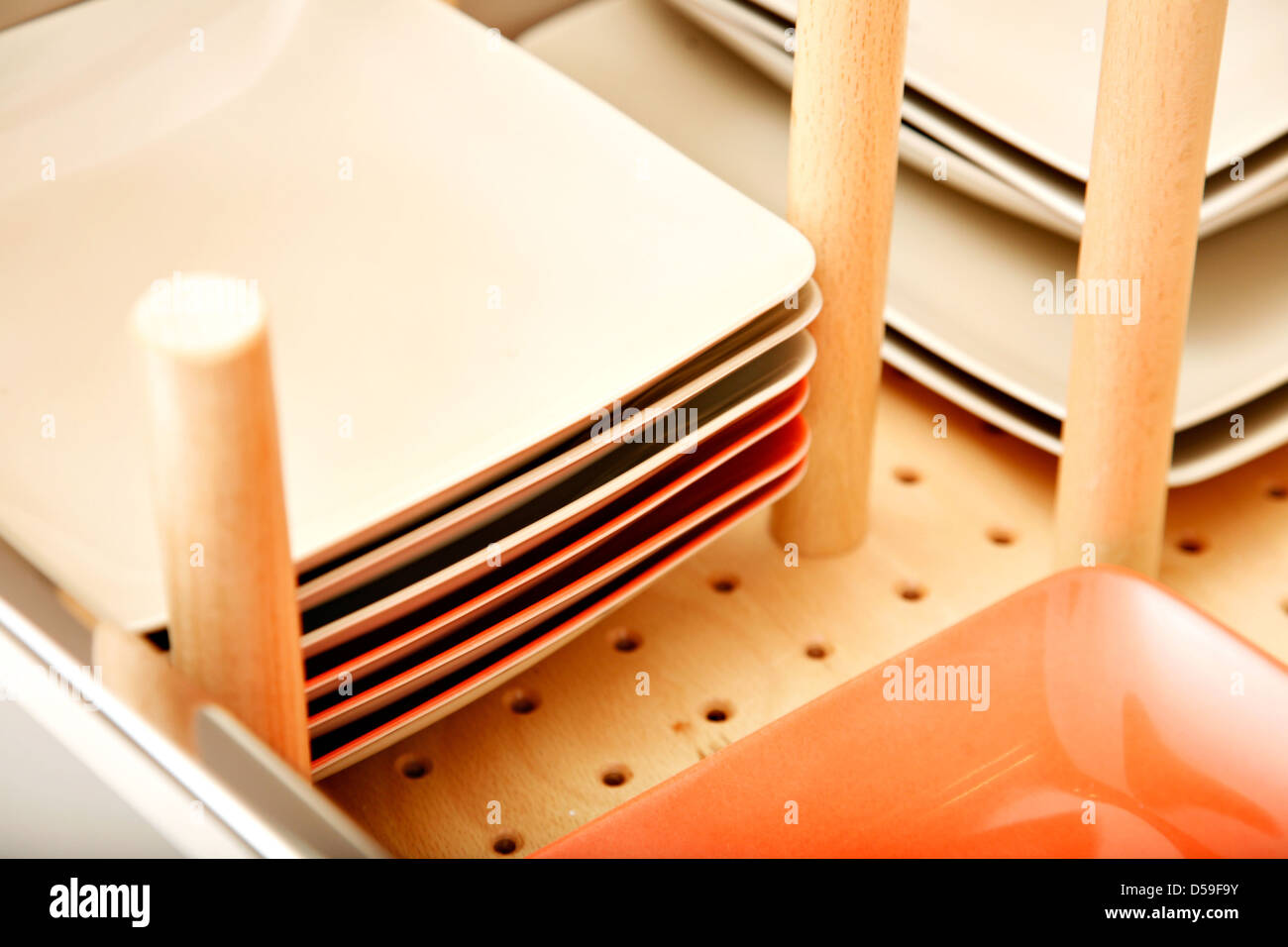 Close Up Of Divider In A Drawer For Dishes Containing Colourful