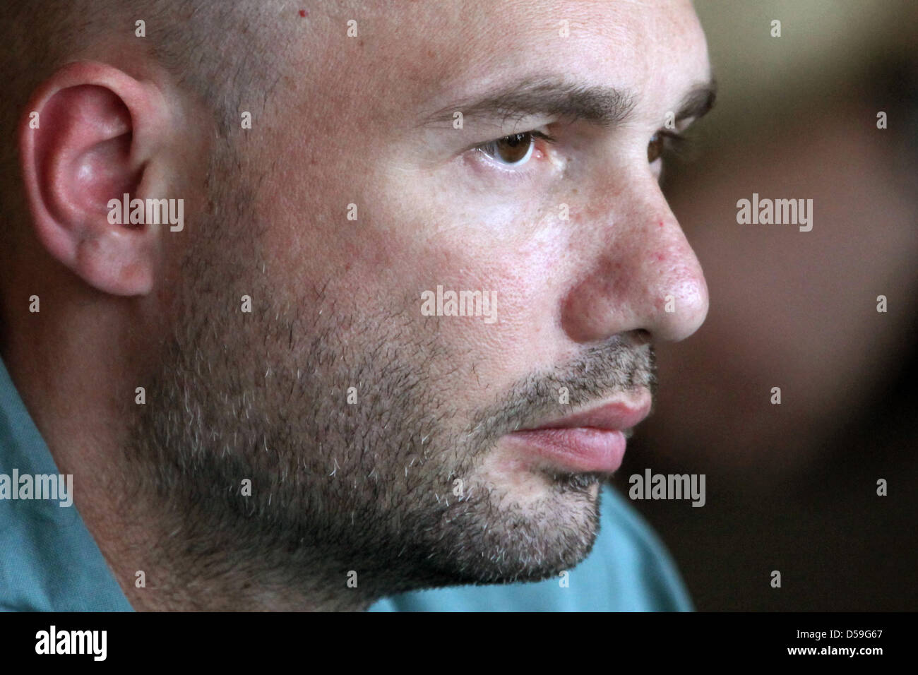 Alexander R.- accused of murder- sits in a courtroom of the regional ...
