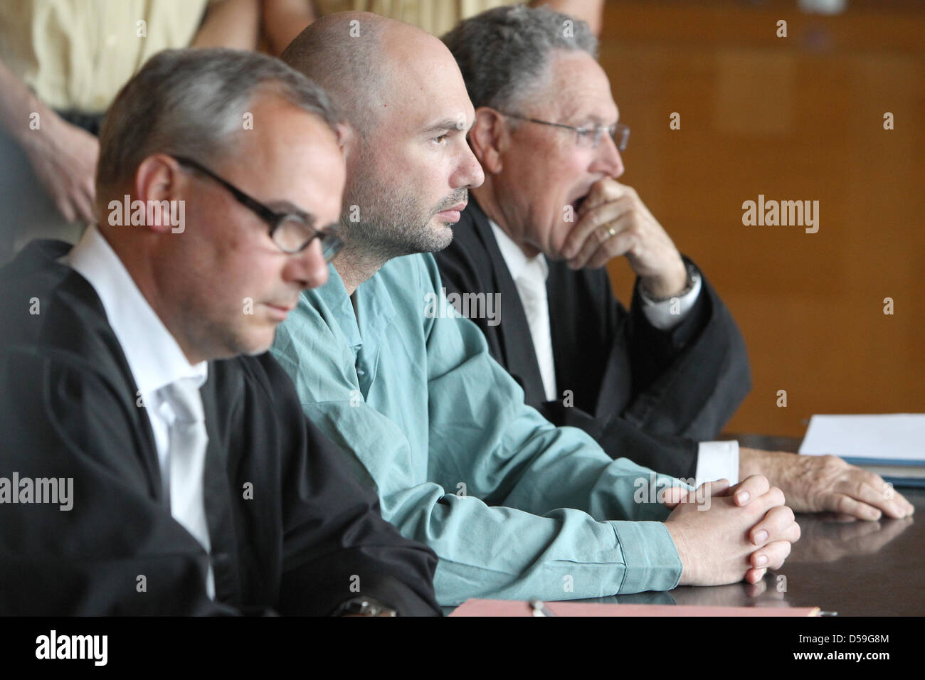 Alexander R.- accused of murder- sits in a courtroom of the regional ...