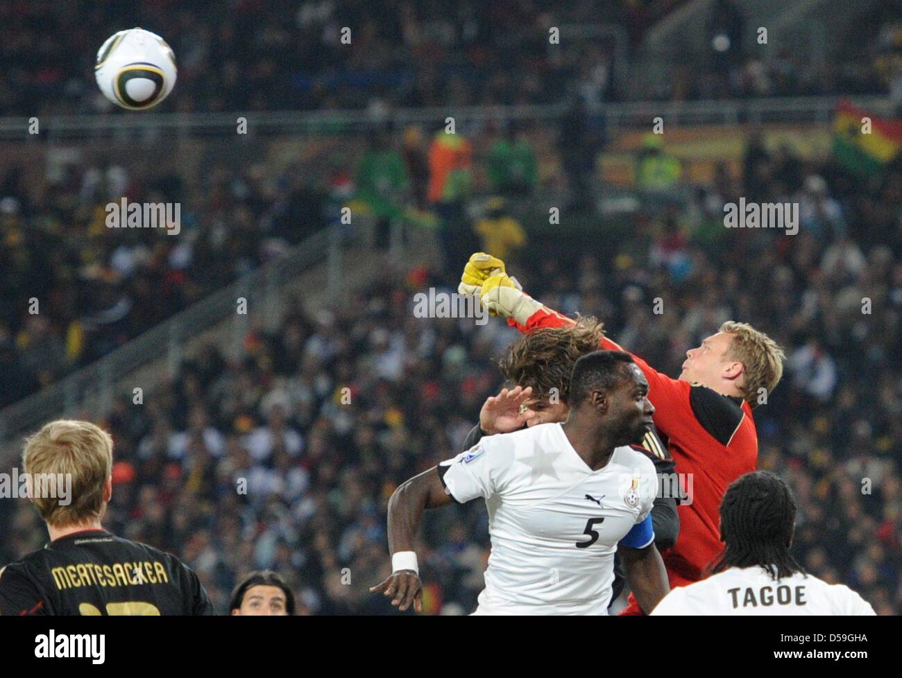 Germany's goalkeeper Manuel Neuer saves against Ghana's John Mensah during the 2010 FIFA World Cup group D match between Ghana and Germany at Soccer City, Johannesburg, South Africa 23 June 2010. Photo: Marcus Brandt dpa - Please refer to http://dpaq.de/FIFA-WM2010-TC  +++(c) dpa - Bildfunk+++ Stock Photo
