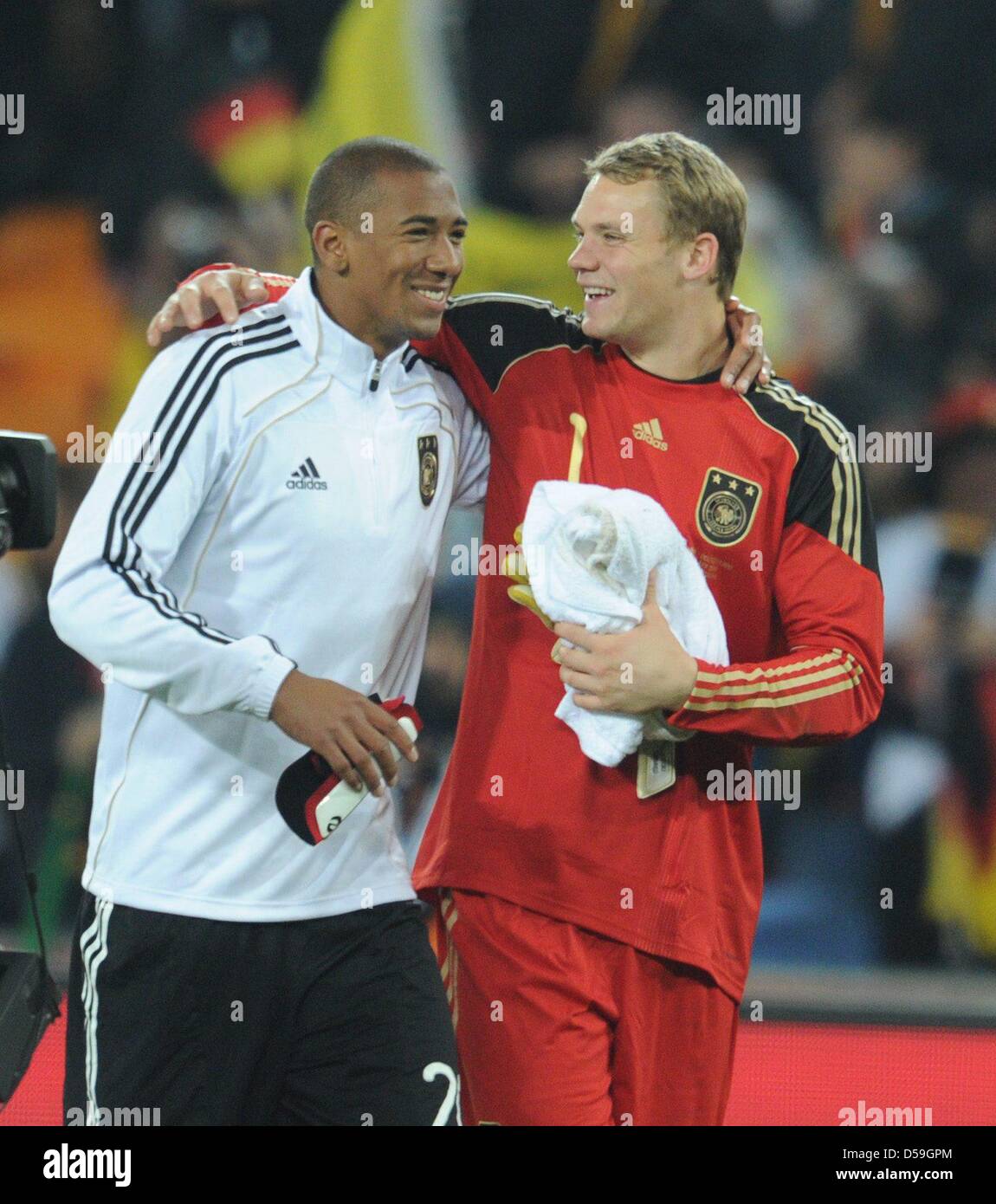 Jerome Boateng (L) and goalkeeper Manuel Neuer of Germany celebrate after the final whistle oft the FIFA World Cup 2010 group D match between Ghana and Germany at the Soccer City Stadium in Johannesburg, South Africa 23 June 2010. Photo: Bernd Weissbrod dpa - Please refer to http://dpaq.de/FIFA-WM2010-TC Stock Photo