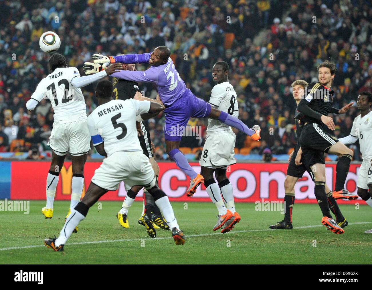 Goalkeeper Richard Kingson (C) of Ghana soars through the air during the FIFA World Cup 2010 group D match between Ghana and Germany at the Soccer City Stadium in Johannesburg, South Africa 23 June 2010. Photo: Bernd Weissbrod dpa - Please refer to http://dpaq.de/FIFA-WM2010-TC Stock Photo