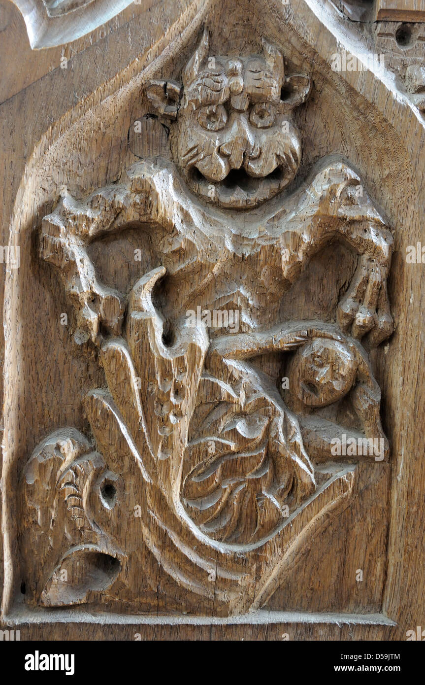The 'Jaws of Hell' choir stall carving in Horning parish church, Norfolk Broads Stock Photo