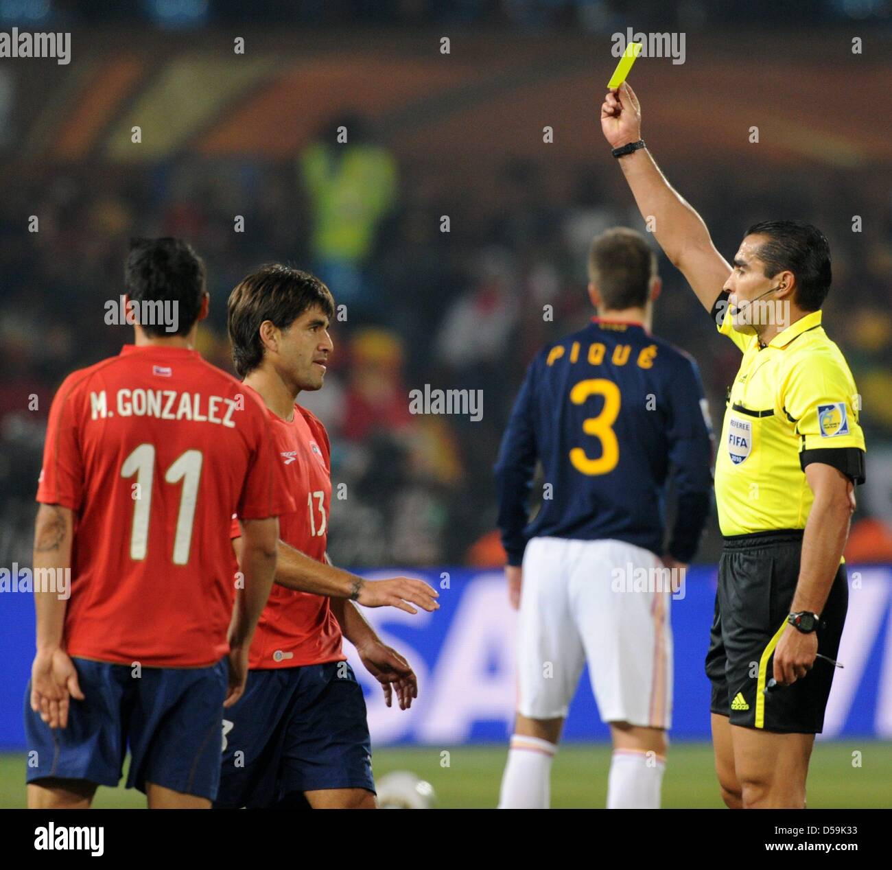 Chile's Marco Estrada is booked with the yellow card by Mexican referee Marco Rodriguez during the 2010 FIFA World Cup group H match between Chile and Spain at Loftus Versfeld Stadium in Pretoria, South Africa 25 June 2010. Photo: Marcus Brandt dpa - Please refer to http://dpaq.de/FIFA-WM2010-TC Stock Photo