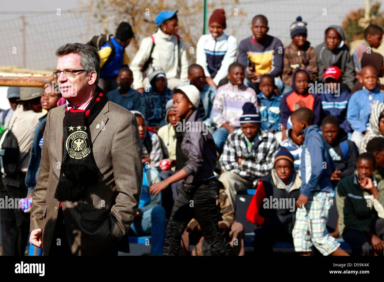 German interior minister Thomas de Maiziere stands in the courtyard of the LoveLife Youth Center during his visit to the Orange Farm township, about 30km south of Johannesburg, South Africa on 27 June 2010. De Maiziere is on a three-day visit to South Africa. Photo: Kerim Okten -  +++(c) dpa - Bildfunk+++ Stock Photo