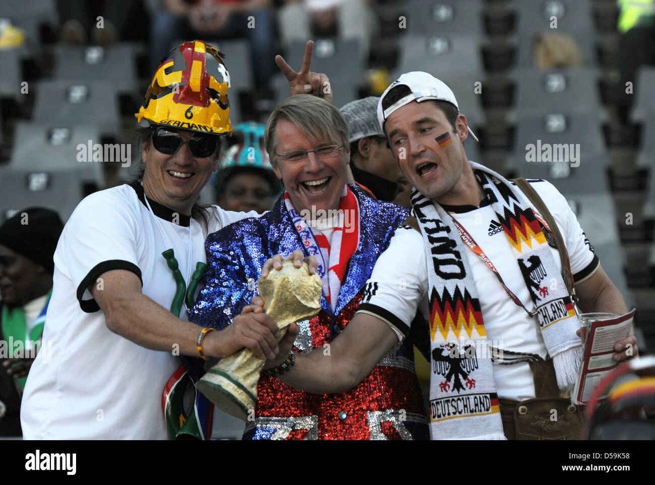 Fans celebrate on the stand prior to the 2010 FIFA World Cup Round of Sixteen match between Germany and England at the Free State Stadium in Bloemfontein, South Africa 27 June 2010. Photo: Marcus Brandt dpa - Please refer to http://dpaq.de/FIFA-WM2010-TC  +++(c) dpa - Bildfunk+++ Stock Photo