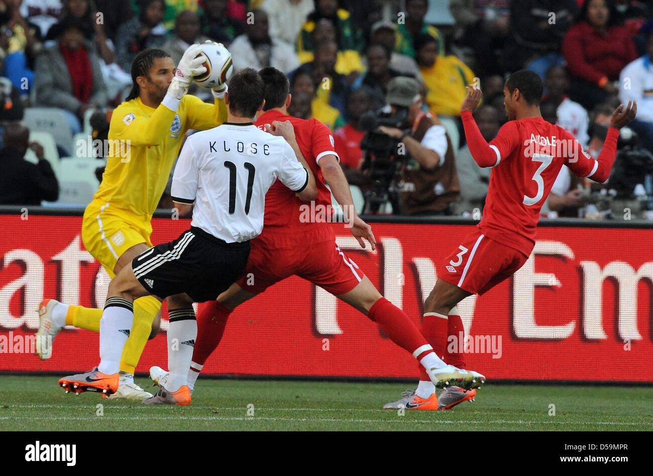Germany's Miroslav Klose vies for the ball with England's goalkeeper David James (L-R), John Terry and Ashley Cole during the 2010 FIFA World Cup Round of Sixteen match between Germany and England at the Free State Stadium in Bloemfontein, South Africa 27 June 2010. Photo: Marcus Brandt dpa - Please refer to http://dpaq.de/FIFA-WM2010-TC Stock Photo