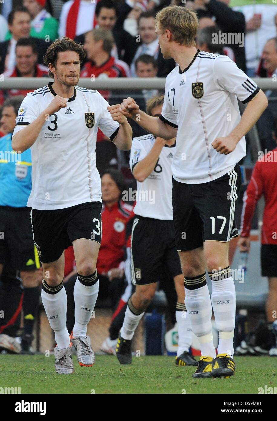 Germany's Arne Friedrich (L) and Per Mertesacker celebrate during the 2010 FIFA World Cup Round of Sixteen match between Germany and England at the Free State Stadium in Bloemfontein, South Africa 27 June 2010. Photo: Marcus Brandt dpa - Please refer to http://dpaq.de/FIFA-WM2010-TC Stock Photo