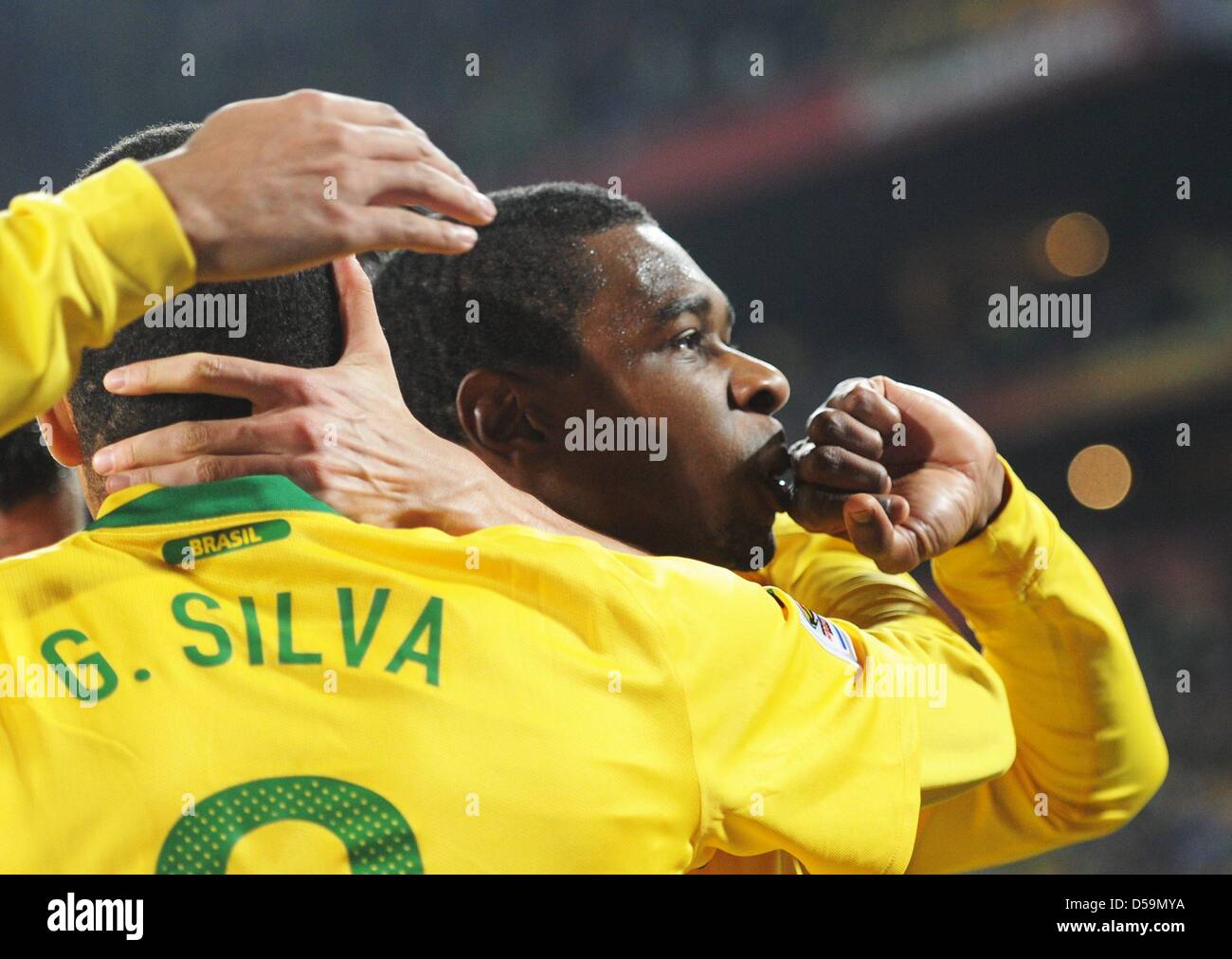 Juan (R) of Brazil celebrates with Gilberto Silva after scoring the 1-0 during the 2010 FIFA World Cup Round of Sixteen match between Brazil and Chile at the Ellis Park Stadium in Johannesburg, South Africa 28 June 2010. Photo: Bernd Weissbrod dpa - Please refer to http://dpaq.de/FIFA-WM2010-TC  +++(c) dpa - Bildfunk+++ Stock Photo