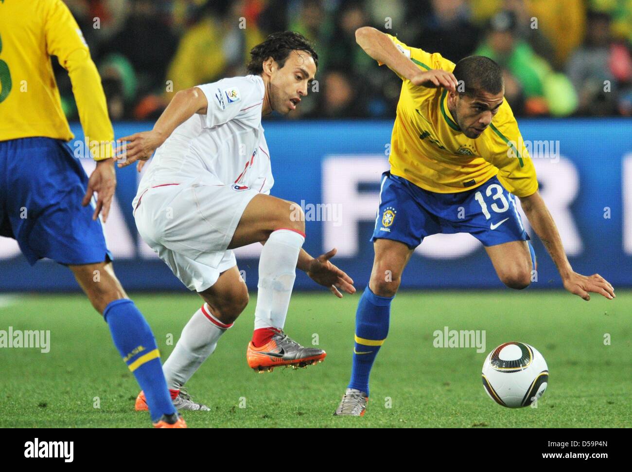 Dani Alves (R) of Brazil vies with Jorge Valdivia of Chile during the 2010 FIFA World Cup Round of Sixteen match between Brazil and Chile at the Ellis Park Stadium in Johannesburg, South Africa 28 June 2010. Photo: Bernd Weissbrod dpa - Please refer to http://dpaq.de/FIFA-WM2010-TC  +++(c) dpa - Bildfunk+++ Stock Photo