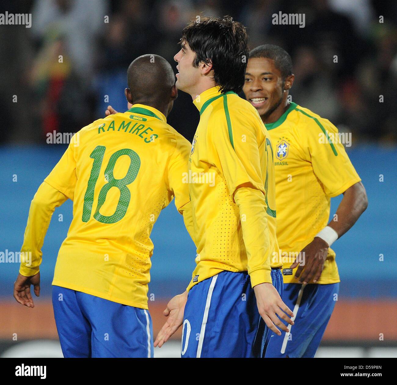 Brazil's Ramires (L-R), Kaka and Michel Bastos celebrate during the 2010 FIFA World Cup Round of Sixteen match between Brazil and Chile at the Ellis Park Stadium in Johannesburg, South Africa 28 June 2010. Photo: Marcus Brandt dpa - Please refer to http://dpaq.de/FIFA-WM2010-TC Stock Photo