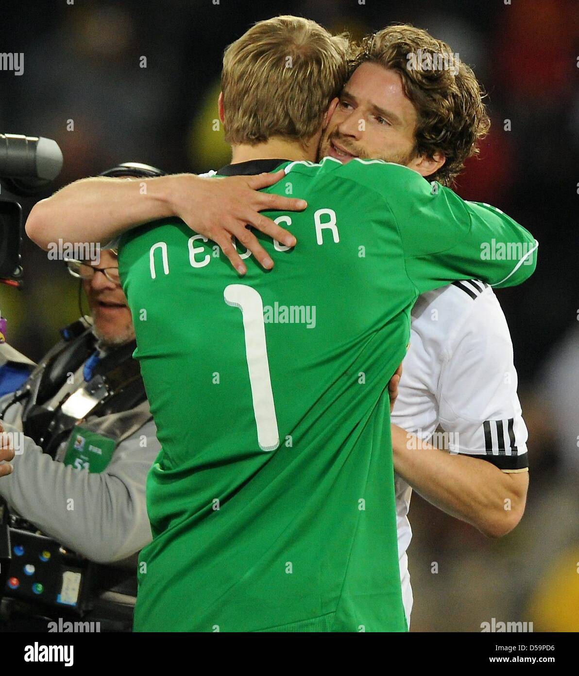 Germany's goalkeeper Manuel Neuer embraces Arne Friedrich after the 2010 FIFA World Cup Round of Sixteen match between Germany and England at the Free State Stadium in Bloemfontein, South Africa 27 June 2010. Photo: Marcus Brandt dpa - Please refer to http://dpaq.de/FIFA-WM2010-TC Stock Photo