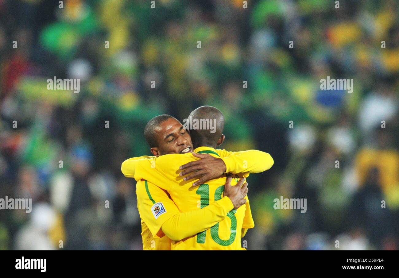 Gilberto Melo and Ramires (R) of Brazil celebrate after the final whistle of the 2010 FIFA World Cup Round of Sixteen match between Brazil and Chile at the Ellis Park Stadium in Johannesburg, South Africa 28 June 2010. Photo: Bernd Weissbrod dpa - Please refer to http://dpaq.de/FIFA-WM2010-TC Stock Photo