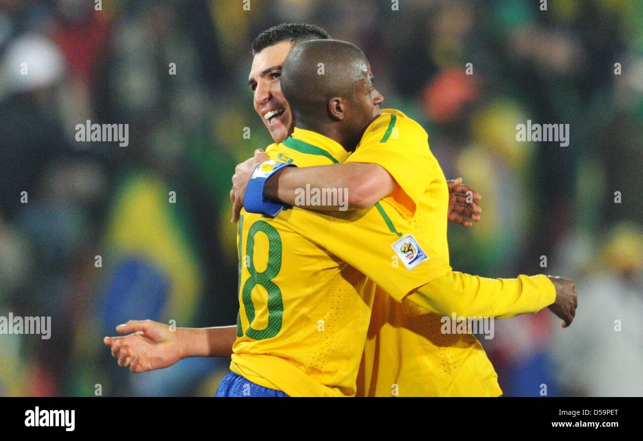 Ramires (L) and Lucio of Brazil celebrate after the final whistle of the 2010 FIFA World Cup Round of Sixteen match between Brazil and Chile at the Ellis Park Stadium in Johannesburg, South Africa 28 June 2010. Photo: Bernd Weissbrod dpa - Please refer to http://dpaq.de/FIFA-WM2010-TC Stock Photo