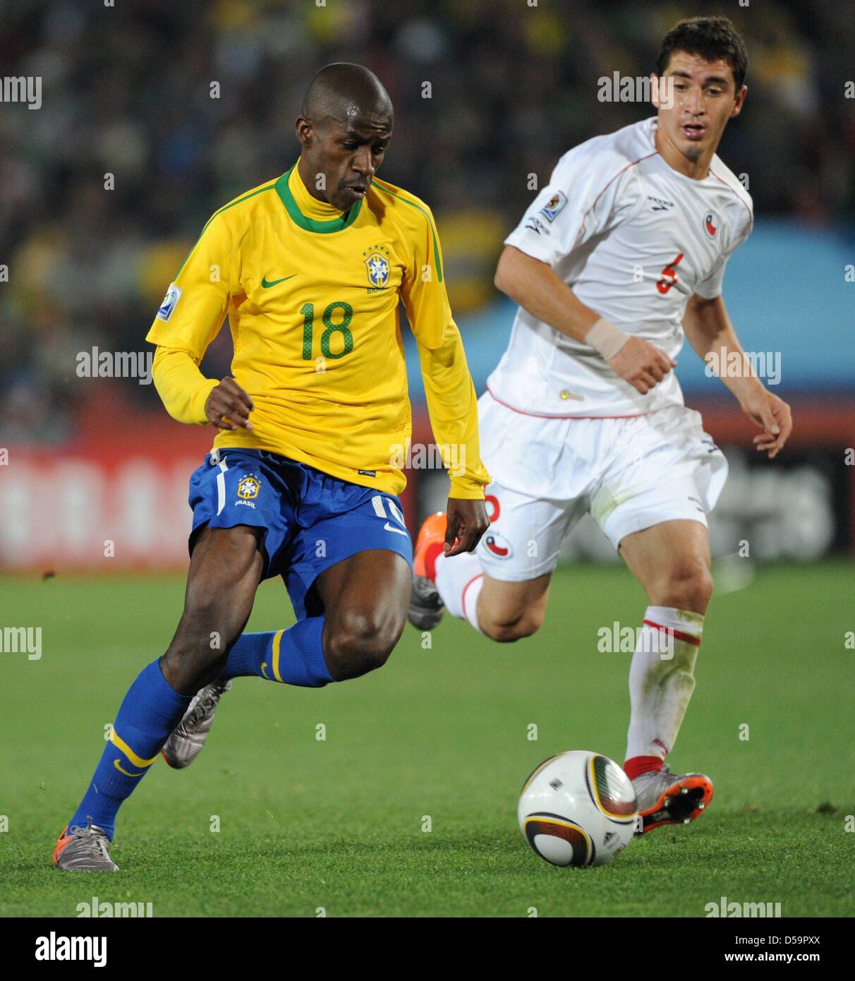 Brazil's Ramires (L) vies for the ball with Chile's Carlos Carmona during the 2010 FIFA World Cup Round of Sixteen match between Brazil and Chile at the Ellis Park Stadium in Johannesburg, South Africa 28 June 2010. Photo: Marcus Brandt dpa - Please refer to http://dpaq.de/FIFA-WM2010-TC Stock Photo