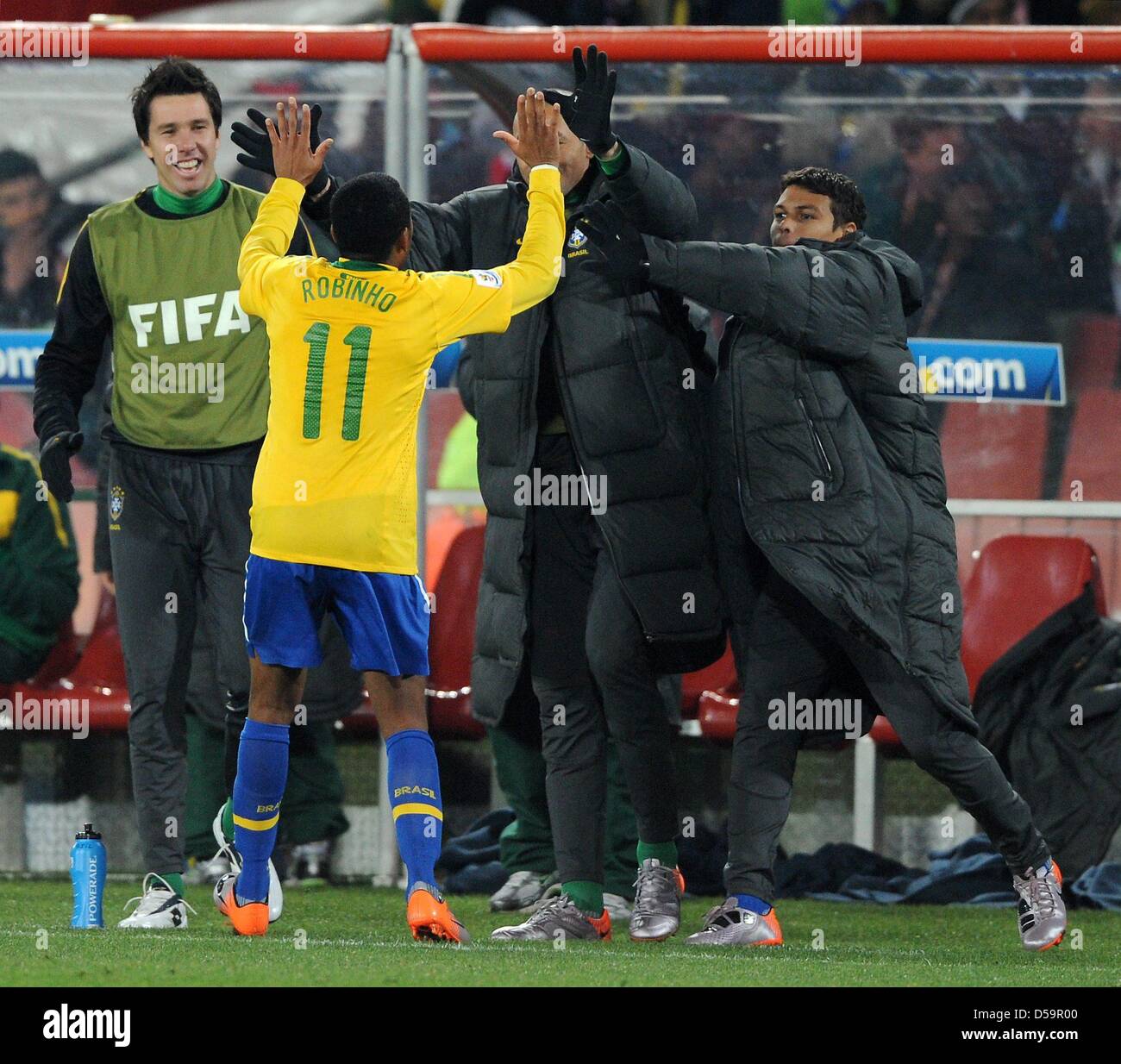 Brazil's Robinho celebrates scoring the 3-0 with substitute players during the 2010 FIFA World Cup Round of Sixteen match between Brazil and Chile at the Ellis Park Stadium in Johannesburg, South Africa 28 June 2010. Photo: Marcus Brandt dpa - Please refer to http://dpaq.de/FIFA-WM2010-TC Stock Photo