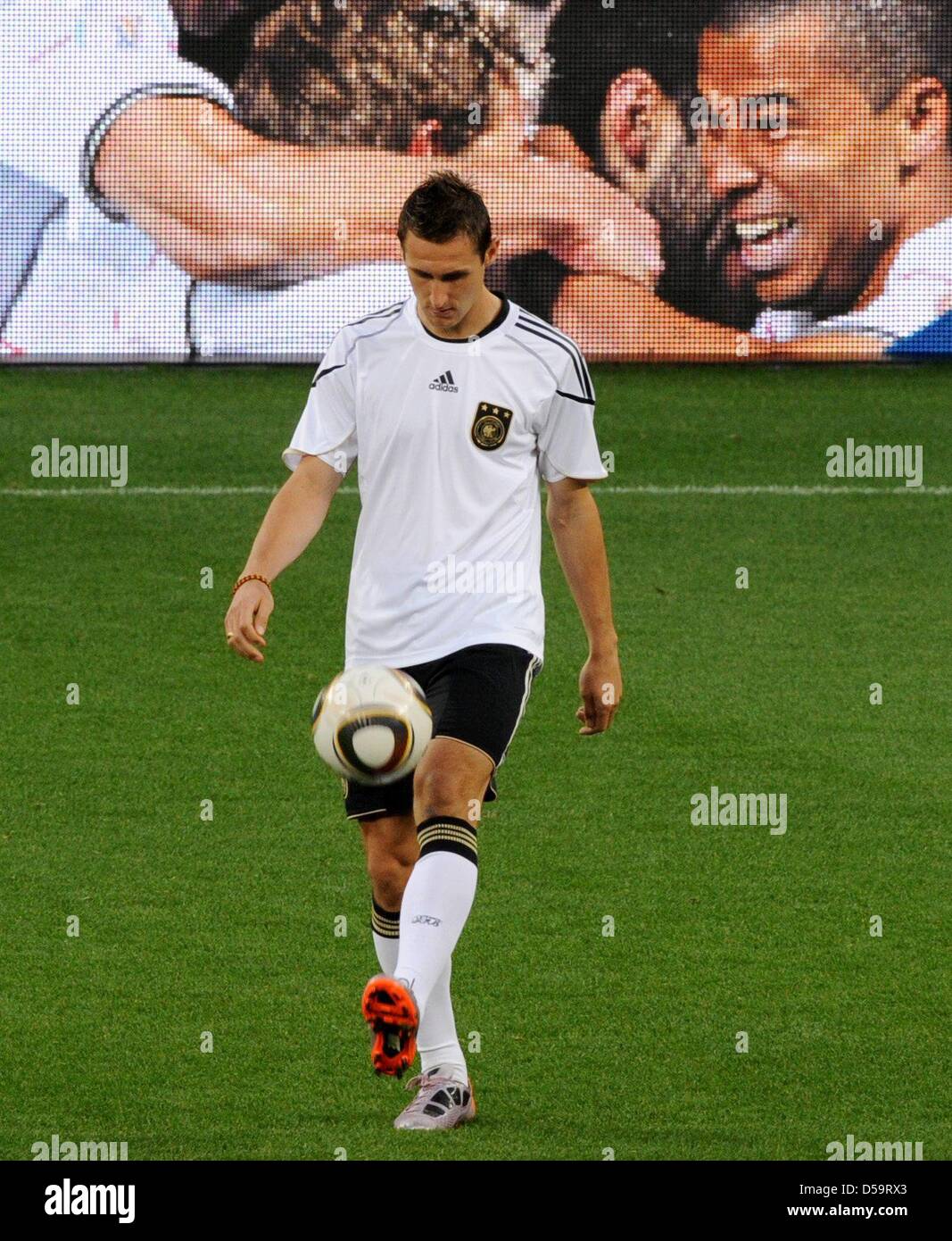 German player Miroslav Klose controls the ball during a training session of the German national soccer team at the Green Point Stadium in Cape Town, South Africa, 02 July 2010. Photo: Marcus Brandt dpa - Please refer to http://dpaq.de/FIFA-WM2010-TC  +++(c) dpa - Bildfunk+++ Stock Photo